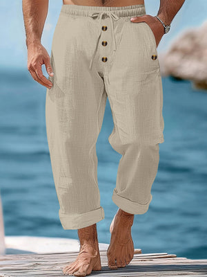 Khaki relaxed fit drawstring sweatpants with button fly and cuffed hems.