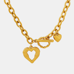 Gold open heart chain necklace with toggle clasp and charm details