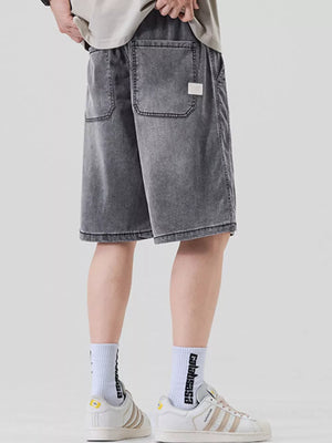 Dark gray loose fit denim shorts for men with elastic waist and back pockets.