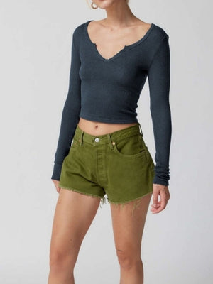 Distressed ribbed crop top in navy with a V-neck and long sleeves.