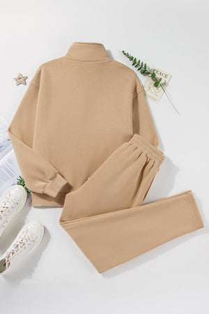 Button-neck lounge set in dust storm beige, featuring a mock neck sweatshirt and elastic waist pants.