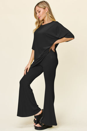 Black oversized tee and flare leg pants set, casual outfit