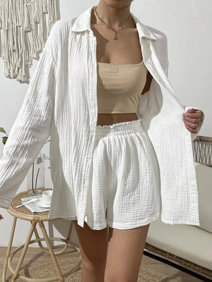 White textured gauze shirt and shorts set with elastic waist shorts and buttoned shirt.