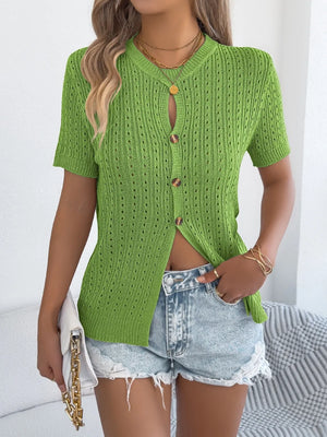Green knit button-up short sleeve cardigan with openwork detail and wood-look buttons.