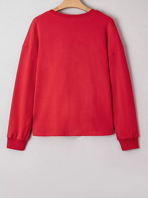 Red cotton crewneck sweatshirt with long sleeves and ribbed cuffs.