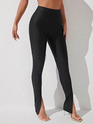 Black cotton leggings with center seam and split hem detail