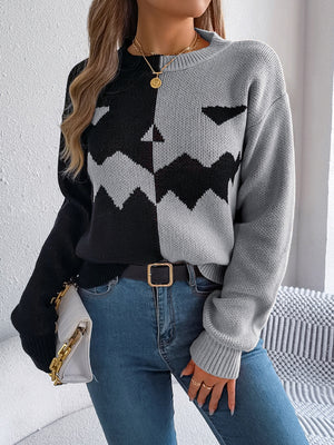 Split-Face Pumpkin Knit Sweater in gray and black acrylic with a zigzag pattern.