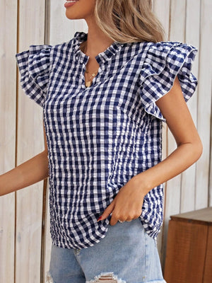 Royal blue gingham blouse with ruffle sleeves and a textured bodice.