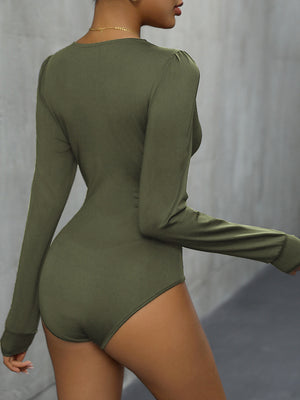 Long sleeve bodysuit in Matcha Green with subtle puff shoulders and a high-cut leg.