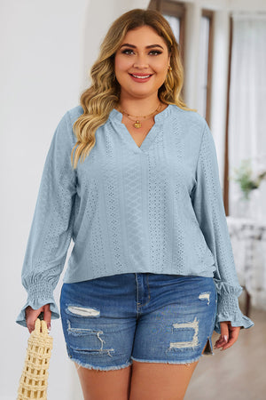 Light blue textured slit-neck blouse with shirred cuffs and eyelet detail
