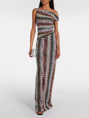 Vibrant one-shoulder maxi dress with chevron pattern and asymmetrical neckline.