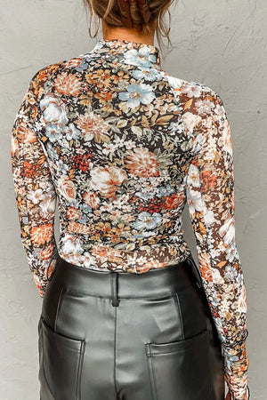 Sheer floral second skin top with long sleeves and a mock neck.