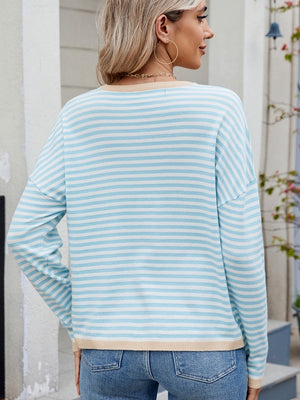 Pastel blue and white striped knit sweater with contrast trim and drop shoulders.