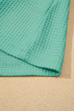 Teal waffle knit shirt with V-neck and lace trim detail