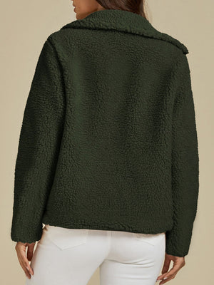 Dark green sherpa zip-up jacket with a textured fleece fabric and collar.