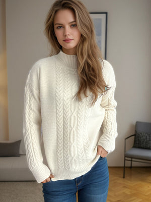 Cream cable knit mock neck sweater with textured acrylic yarn.