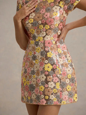 Floral sequin mini dress with short sleeves and colorful floral appliques.