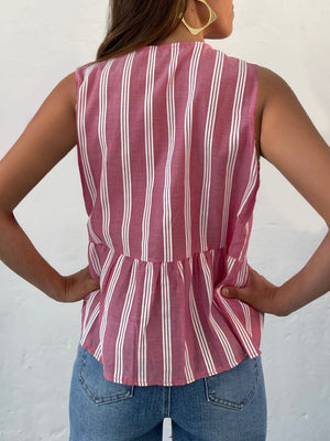 Fuchsia pink and white striped peplum blouse with a bow-tie back detail.