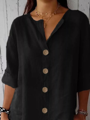 Black button-down shirt with a relaxed fit and wooden buttons.
