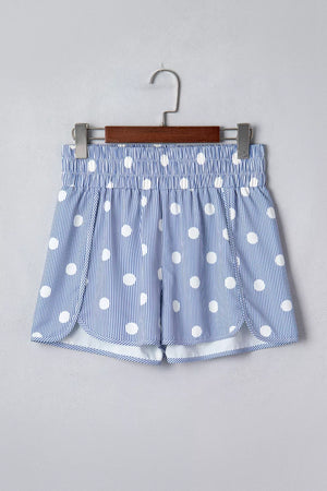 Blue and white polka dot striped shorts with elastic waist and side slits.