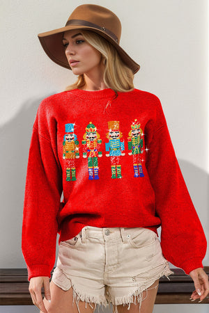 Red knit sweater with sequin nutcracker embellishment and balloon sleeves.