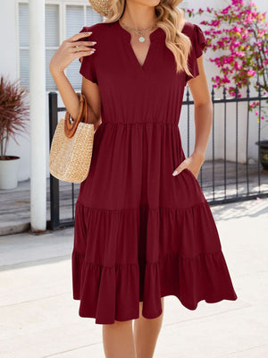 Burgundy ruffled midi dress with notched V-neck and tiered skirt