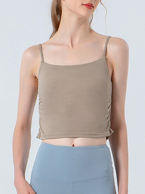 Beige ruched side tank top with spaghetti straps and a square neckline.
