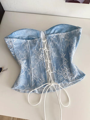 Blue lace corset top with white lace overlay and adjustable front lacing