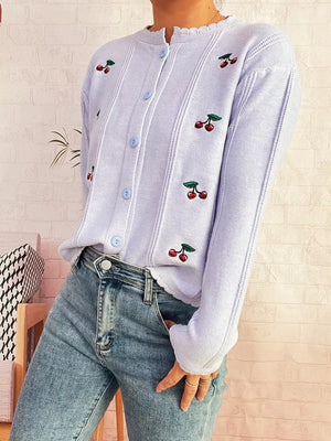 Light blue button up cardigan with cherry embroidery and ruffle trim