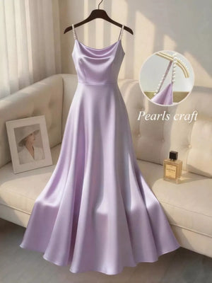 Light purple satin cami dress with pearl-embellished straps and a cowl neckline.