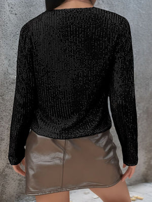 Black sequin bolero jacket with long sleeves and a textured finish.