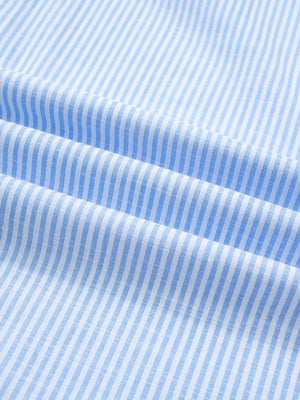 Blue and white striped button-down shirt fabric detail
