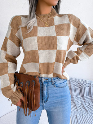Checkerboard knit mock neck pullover in camel and ivory acrylic with long sleeves.