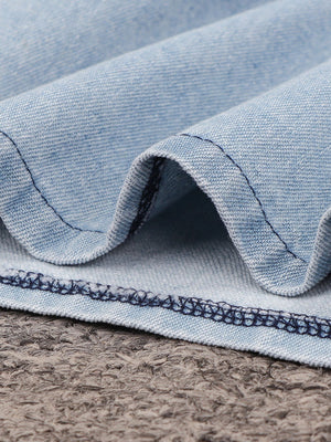 Light wash denim mini dress with visible stitching detail