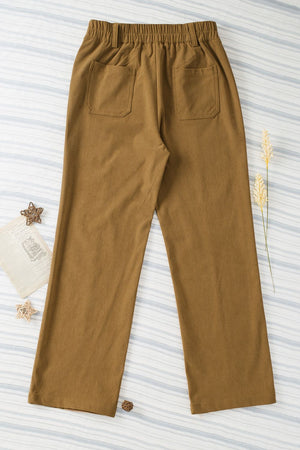 Caramel seamed front wide leg trousers with elastic waist and two back pockets.