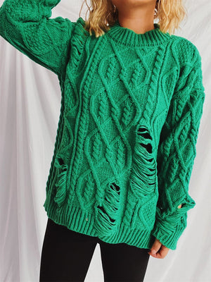 Green distressed cable knit sweater with ripped details and crew neck.