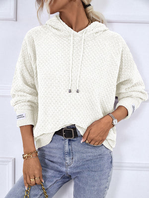 White textured knit raglan sleeve hoodie with drawstring hood and cuff detail.