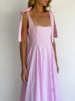 Pink maxi dress with square neckline and bow tie shoulder straps
