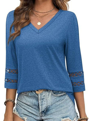 Blue V-neck t-shirt with 3/4 sleeves featuring cutout detail at the cuffs.