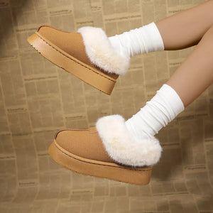 Brown plush suede platform slippers with white faux fur trim and white slouch socks.