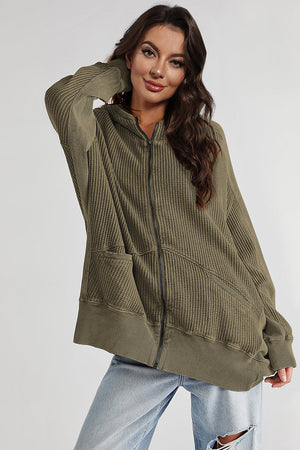 Army green waffle knit zip-through hoodie with pockets and a relaxed fit.
