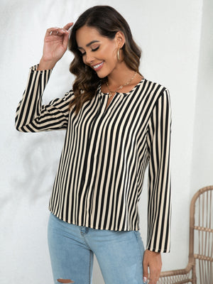 Vertical stripe blouse in tan and white with keyhole neckline and long sleeves.