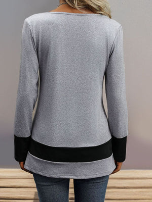 Gray long sleeve top with black contrast band detail at hem