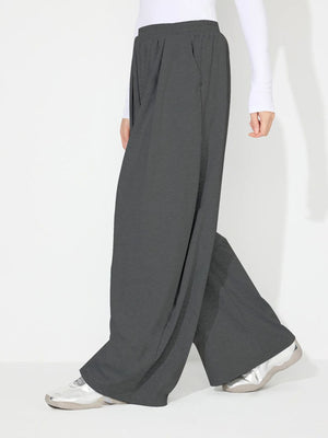 Dark Gray pleated drape palazzo trousers with a wide leg and elastic waistband.