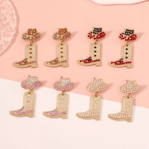 Rhinestone cowboy boot dangle earrings in red, pink, brown, and white with hat detail.