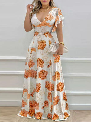 Maxi dress in pumpkin floral print with V-neck and ruffle sleeves.