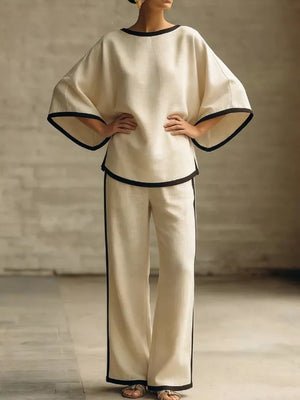 Apricot two-piece set with boat neck top and wide leg pants, featuring contrast trim detail.