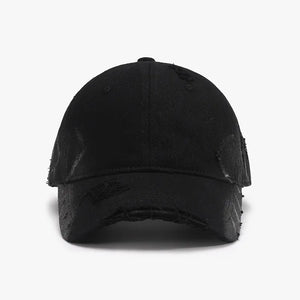 Black distressed denim baseball cap with frayed edges and subtle pattern details.