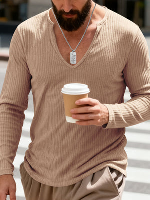 Casual ribbed long sleeve t-shirt in Apricot with a deep V-neck, worn by a man holding a coffee cup.
