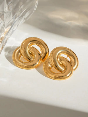 Gold interlocking statement earrings with 18K gold plating.